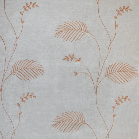 Tissu voilage brodé motif feuilles avec bas plombé