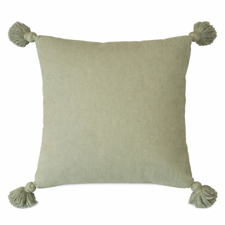 Housse de coussin en laine à pompons