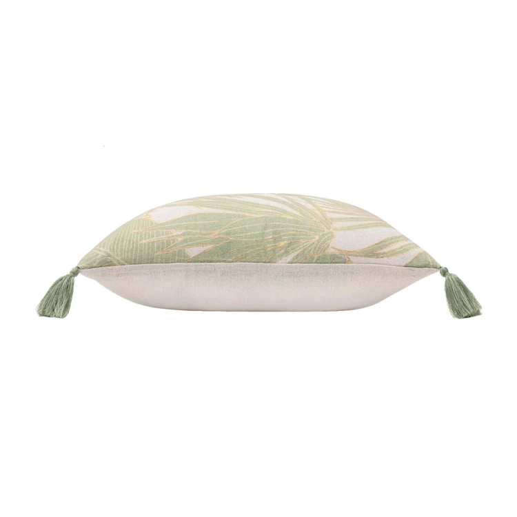 Coussin polycoton feuillages tropicaux métallisé à pompons
