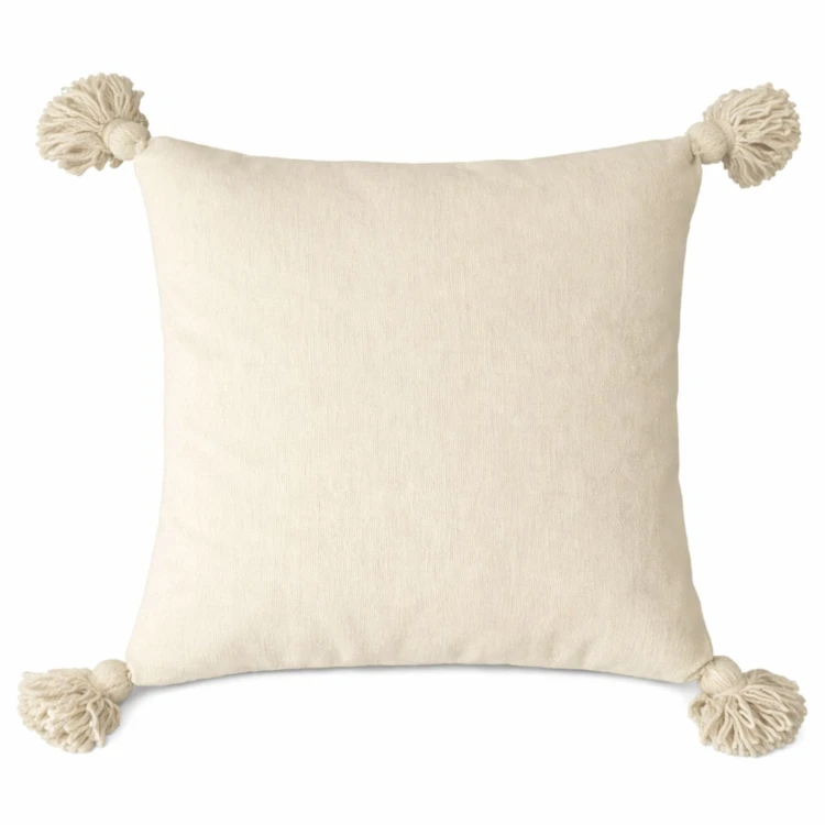 Housse de coussin en laine à pompons