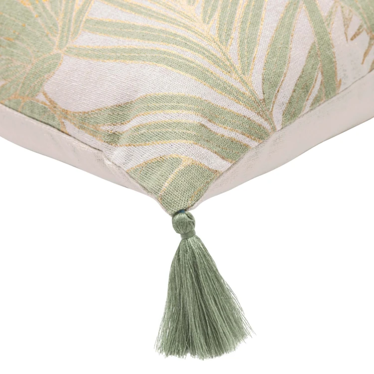 Coussin polycoton feuillages tropicaux métallisé à pompons