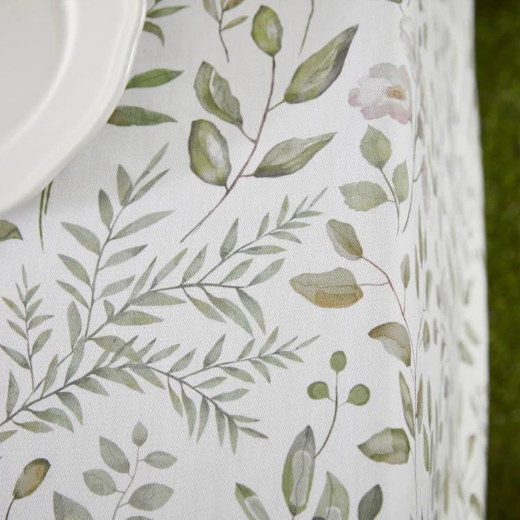 Mantel redondo de algodón con revestimiento antimanchas y estampado vegetal