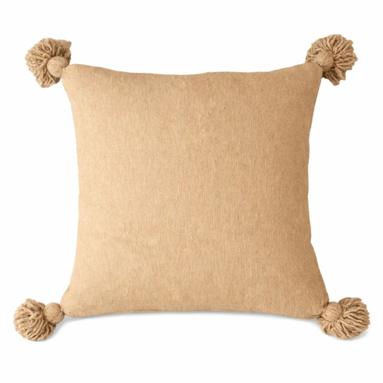 Housse de coussin en laine à pompons