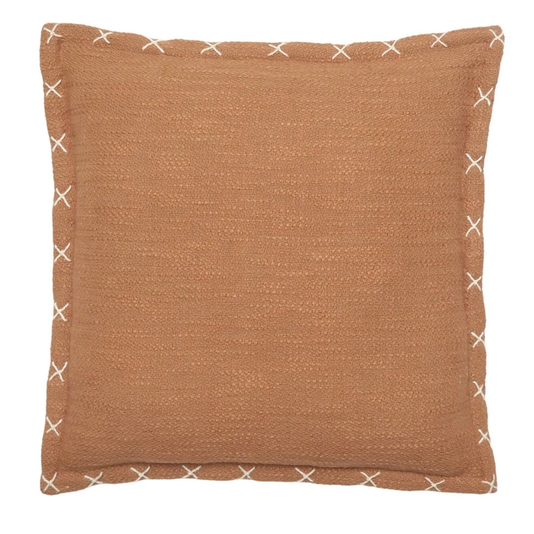 Housse de coussin brodée avec motifs en croix