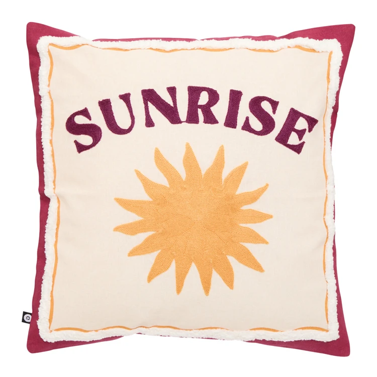 Cojín decorativo de algodón bordado con un motivo de sol
