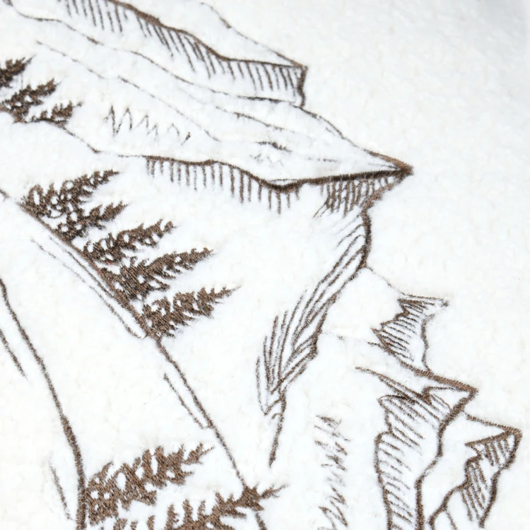 Cojín rectangular de rizo con motivo de montaña