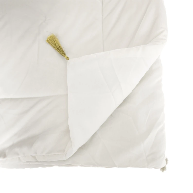 Trapunta in velluto con nappe