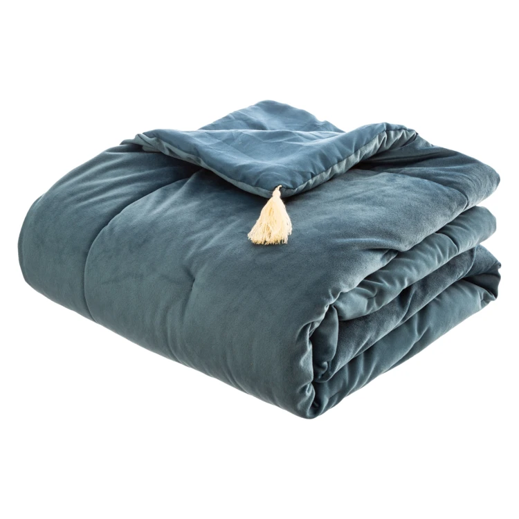 Trapunta in velluto con nappe