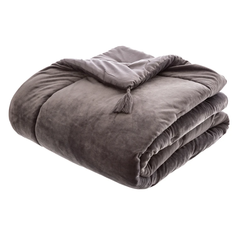 Trapunta in velluto con nappe