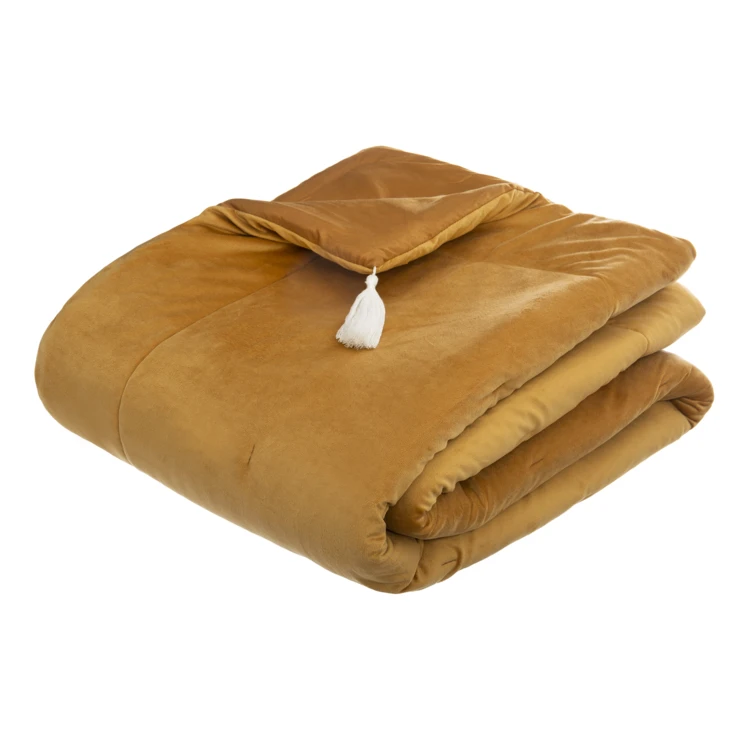 Trapunta in velluto con nappe