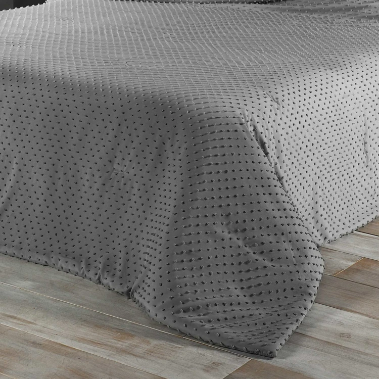 Colcha de cama com pequenas borlas