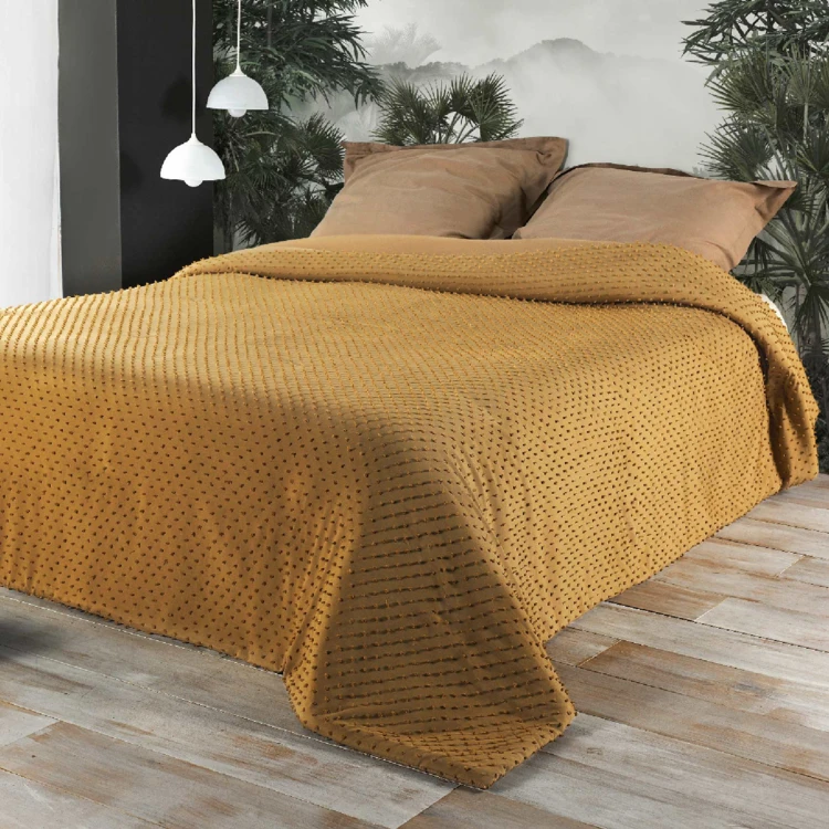 Colcha de cama com pequenas borlas