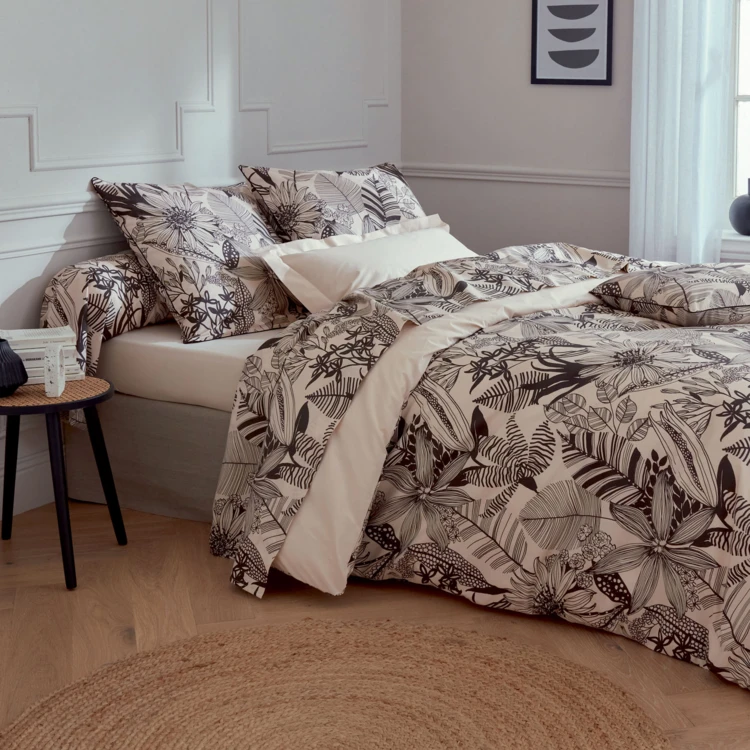 Almohada cilíndrica con estampados negros